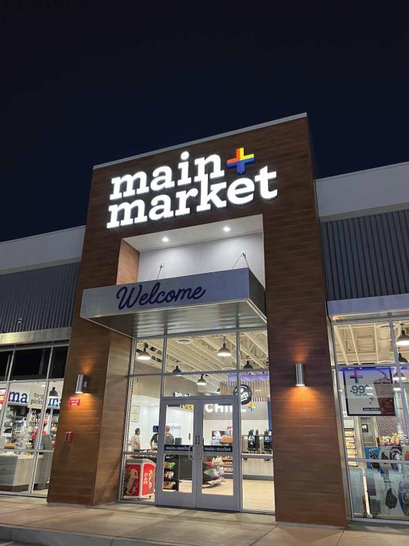 Main + Market storefront lit at night